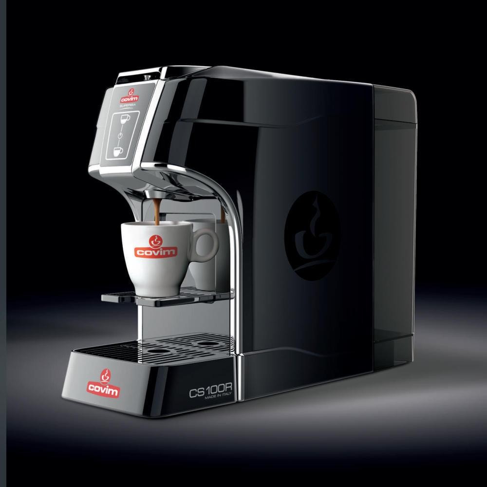 Covim CS100R capsule espresso machine dispensing an espresso into a branded cup
